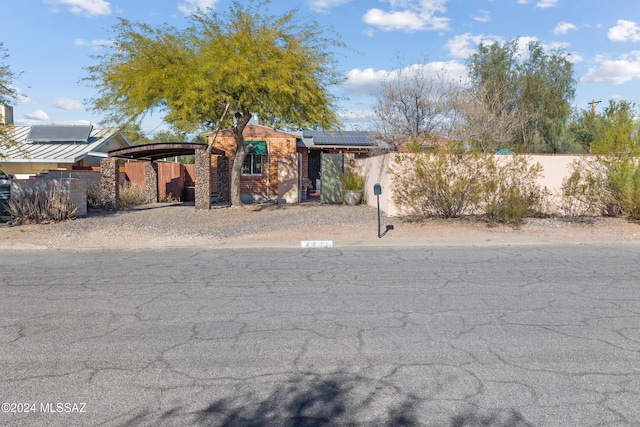 view of front of home featuring solar panels