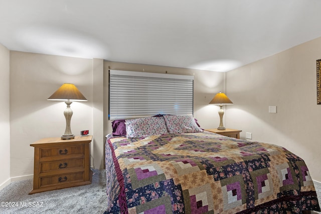 bedroom featuring light colored carpet