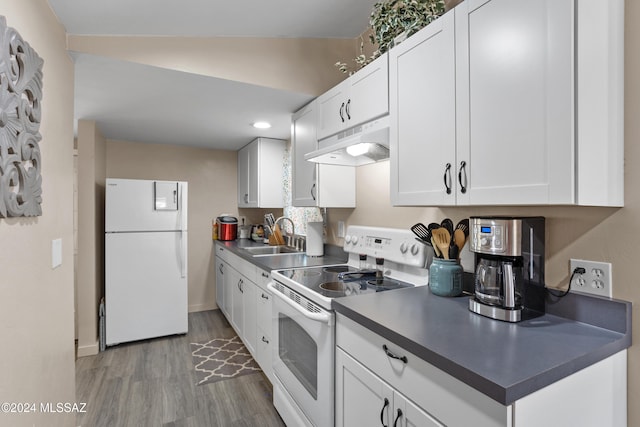 kitchen featuring white appliances, hardwood / wood-style flooring, white cabinetry, and sink