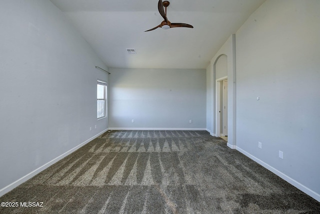 carpeted empty room featuring a ceiling fan, lofted ceiling, visible vents, and baseboards