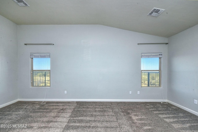 unfurnished room featuring carpet, visible vents, and a healthy amount of sunlight