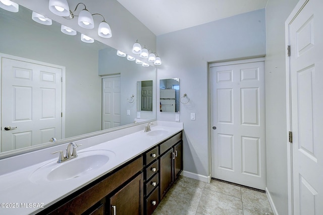 bathroom featuring tile patterned flooring and vanity