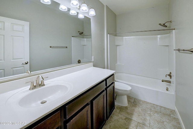 full bathroom with toilet, vanity, baseboards,  shower combination, and tile patterned floors