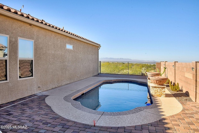 view of swimming pool with a patio, a fenced backyard, and a fenced in pool