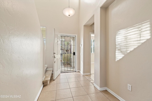 entrance foyer with light tile patterned floors