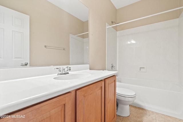 full bathroom featuring tile patterned floors, vanity, bathtub / shower combination, and toilet