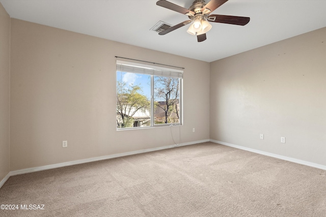 empty room with carpet and ceiling fan