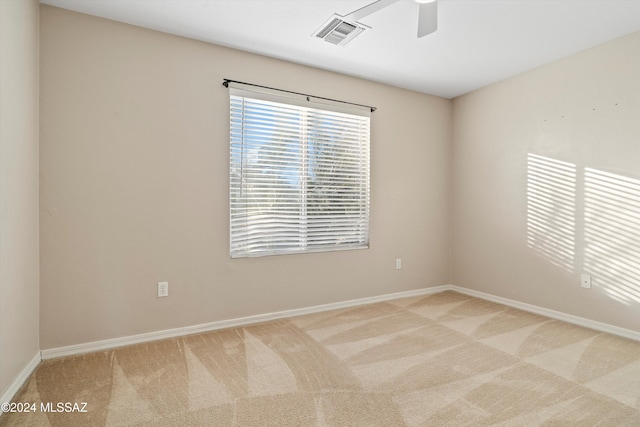 empty room featuring carpet and ceiling fan