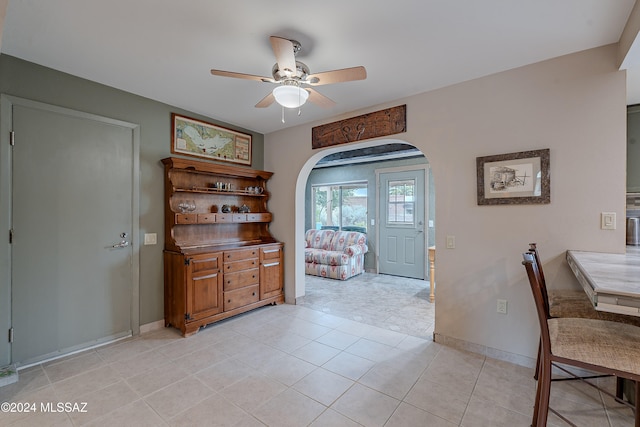 home office featuring ceiling fan and light tile patterned flooring