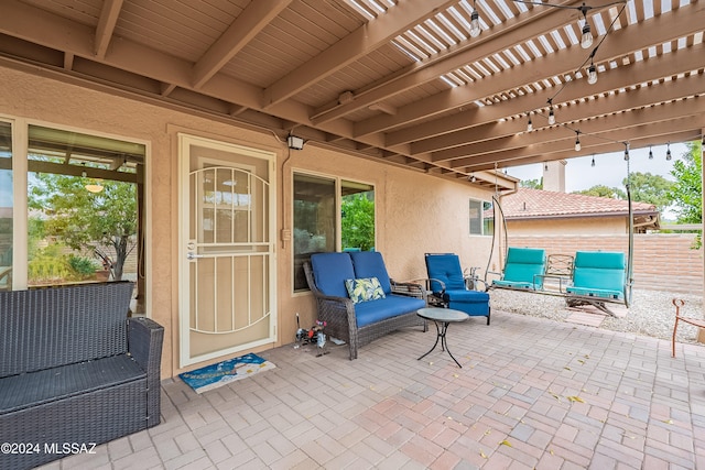 view of patio / terrace featuring a pergola and an outdoor hangout area