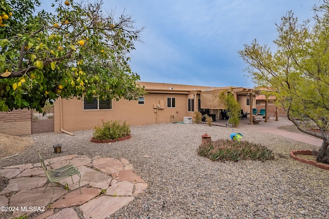 back of property with a patio area