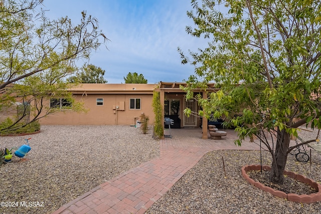 rear view of property with a patio