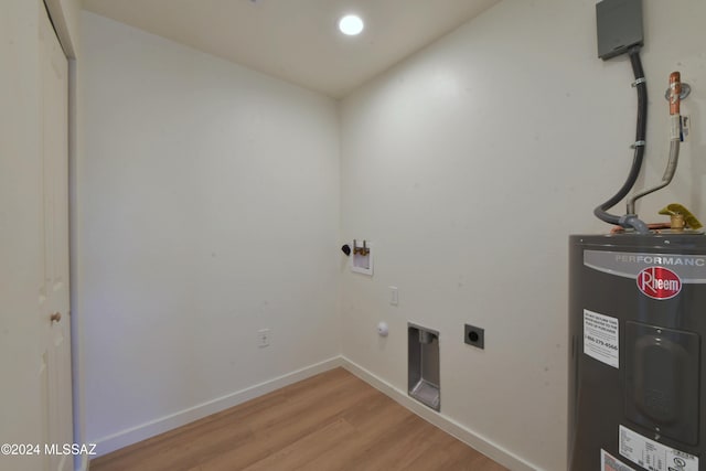 washroom featuring hookup for a washing machine, light wood-type flooring, electric dryer hookup, and water heater