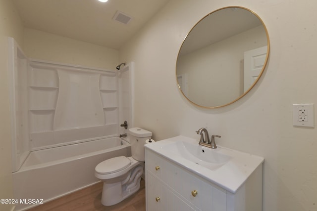 full bathroom with hardwood / wood-style floors, vanity, toilet, and tub / shower combination