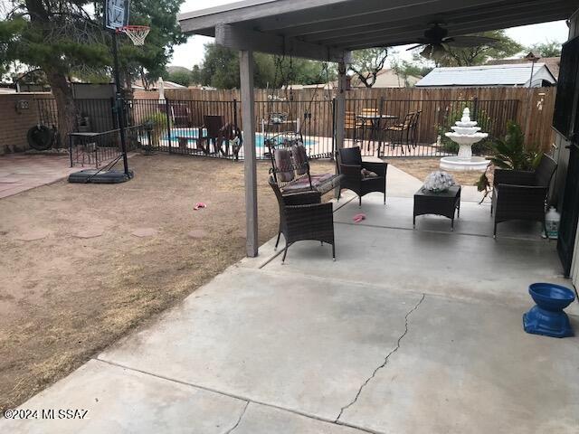 view of patio featuring ceiling fan