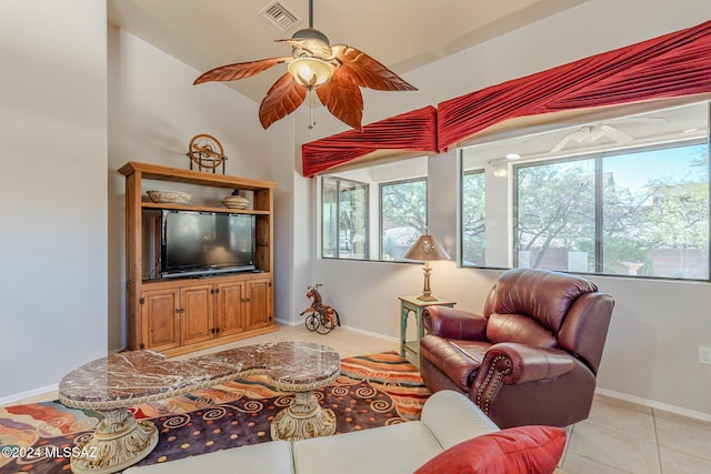 living room with light tile patterned floors and vaulted ceiling