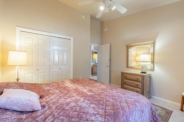 tiled bedroom featuring a closet and ceiling fan