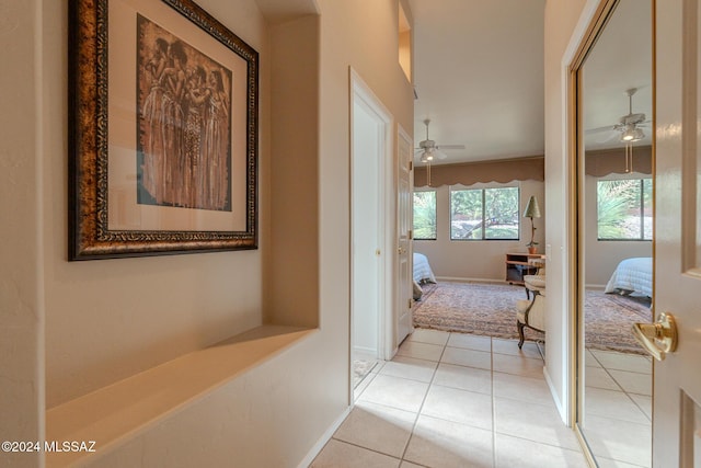 hall featuring light tile patterned floors