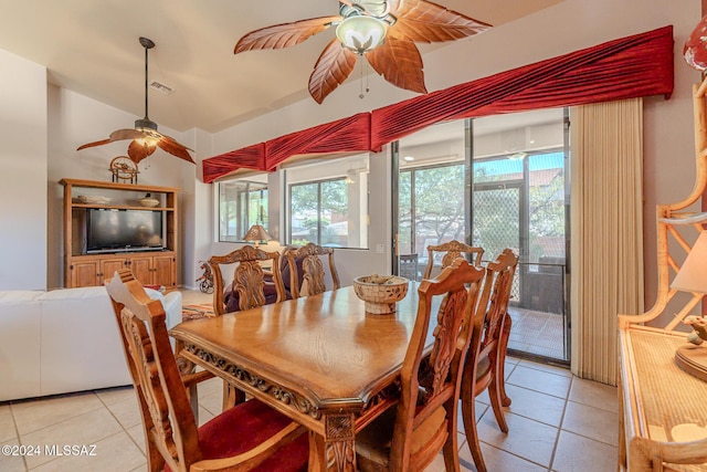 dining area featuring ceiling fan, a wealth of natural light, and light tile patterned flooring