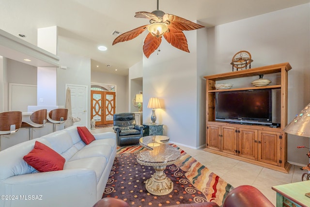 living room with ceiling fan and light tile patterned floors