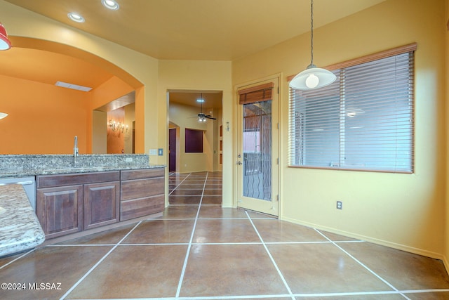 bathroom with tile patterned flooring, ceiling fan, and vanity