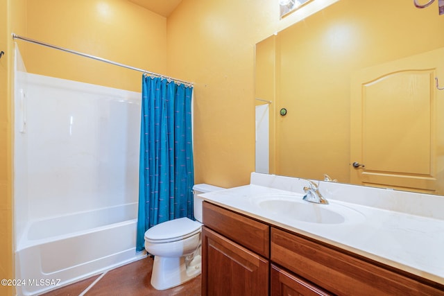 full bathroom featuring vanity, toilet, and shower / bath combo with shower curtain