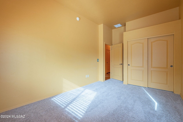 unfurnished bedroom featuring a closet and carpet floors