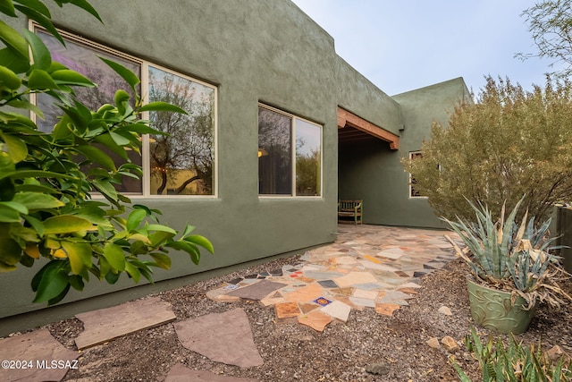 view of side of property with a patio area