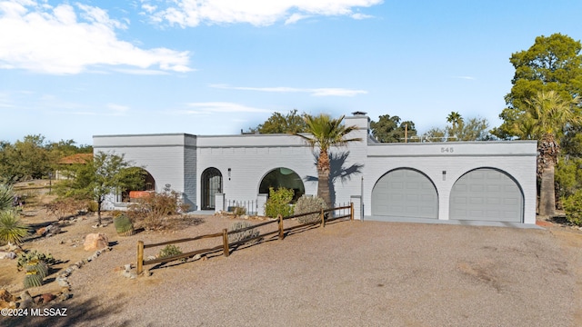 view of front of property with a garage