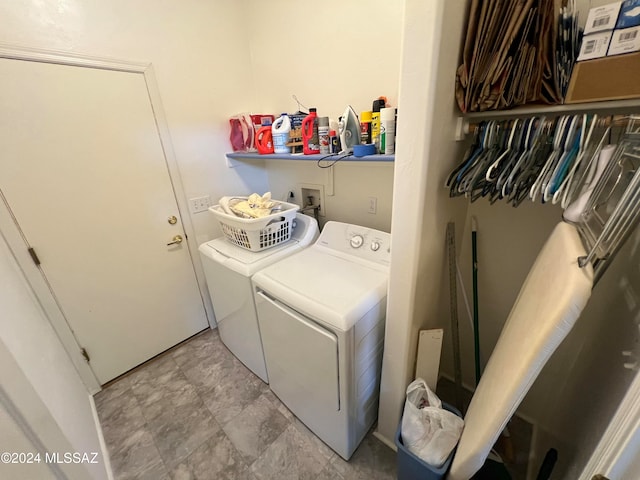 washroom with washing machine and clothes dryer