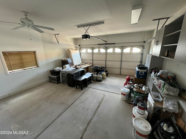 garage featuring ceiling fan and a garage door opener