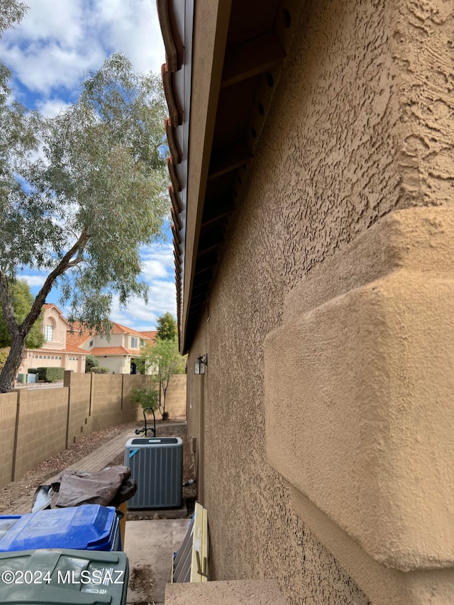 view of side of home featuring central air condition unit