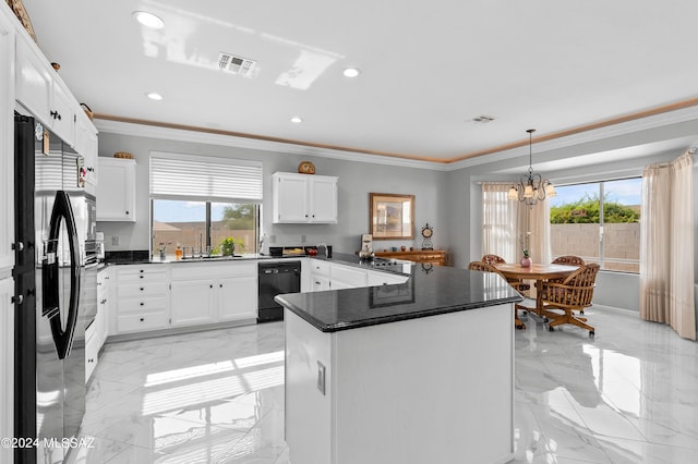 kitchen with white cabinetry, stainless steel fridge, and black dishwasher