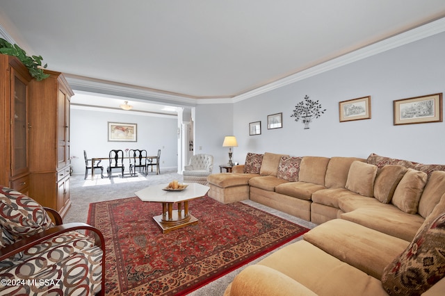 carpeted living room featuring ornamental molding