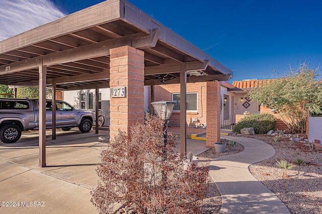 exterior space featuring a carport