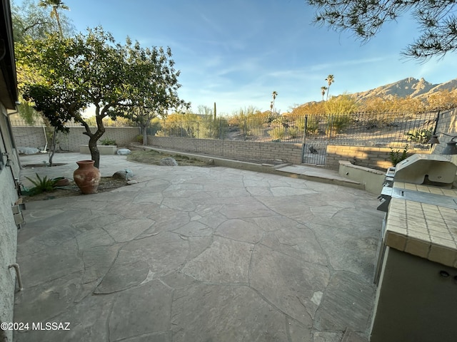 view of patio featuring a mountain view and area for grilling