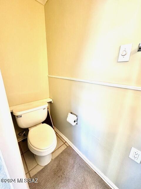 bathroom with tile patterned flooring and toilet