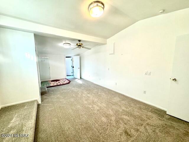 unfurnished room with carpet, ceiling fan, and lofted ceiling