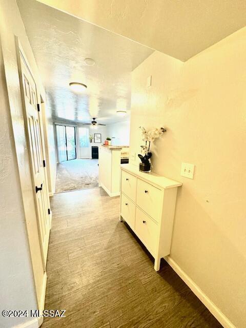 corridor featuring hardwood / wood-style floors