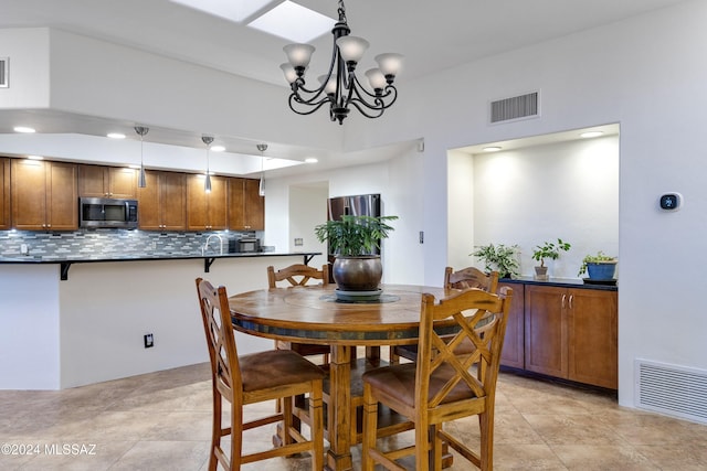 dining space featuring recessed lighting, visible vents, and an inviting chandelier