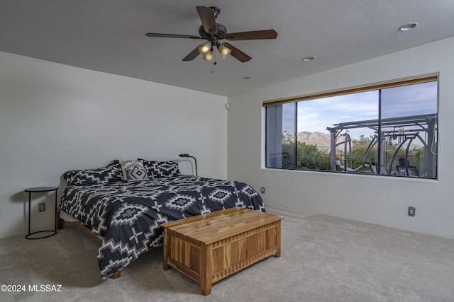 bedroom with carpet and a ceiling fan