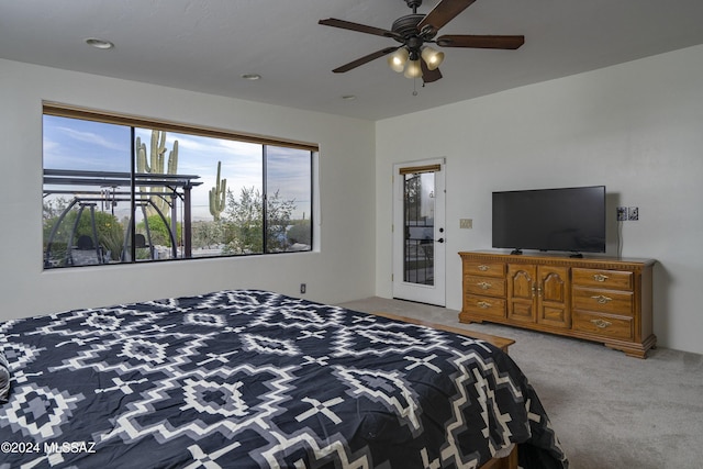 bedroom featuring ceiling fan and carpet