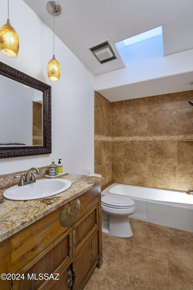 bathroom featuring bathtub / shower combination, visible vents, vanity, and toilet