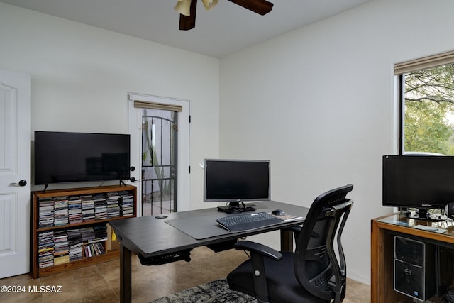 office space with ceiling fan and tile patterned floors