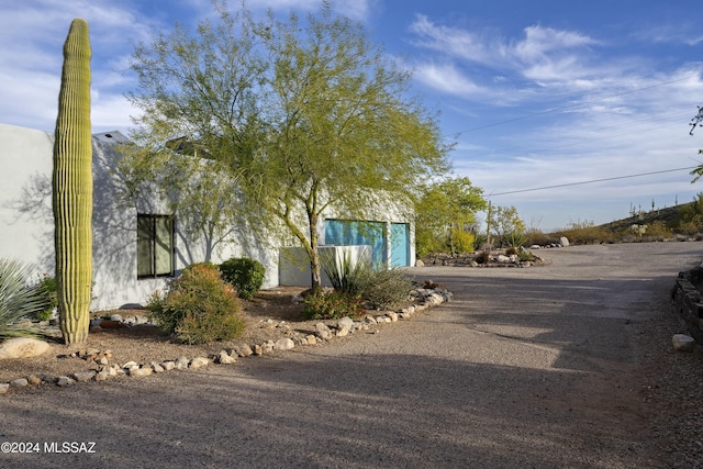 view of front of home featuring driveway and a garage