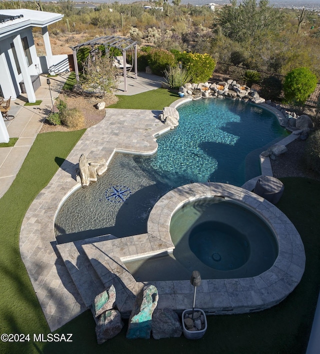 view of pool with a pool with connected hot tub, fence, a pergola, and a patio