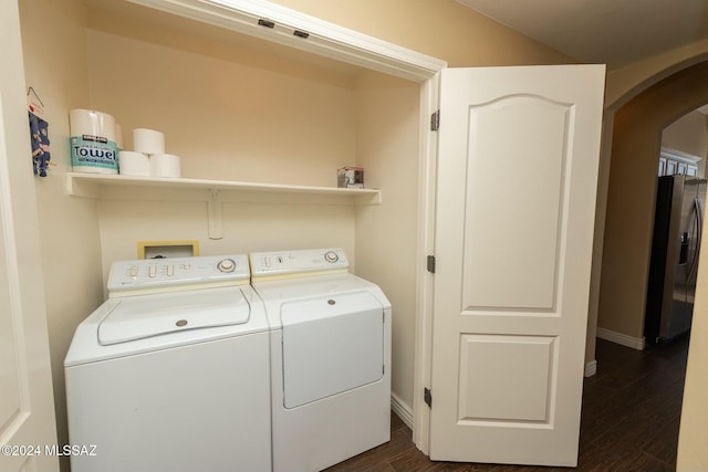 washroom featuring separate washer and dryer and dark hardwood / wood-style floors