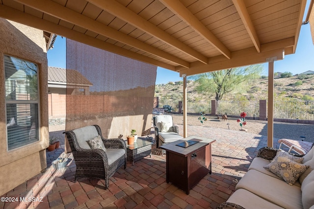 view of patio / terrace with an outdoor living space with a fire pit