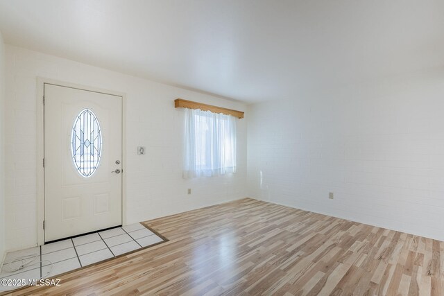 unfurnished living room with light hardwood / wood-style flooring