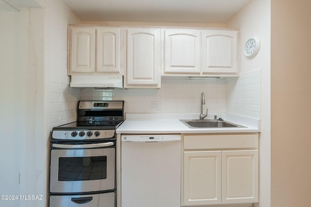 kitchen with white dishwasher, stainless steel electric range, white cabinetry, and sink